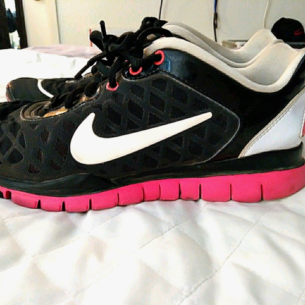 Cutest pair of pink and black NIKE trainers